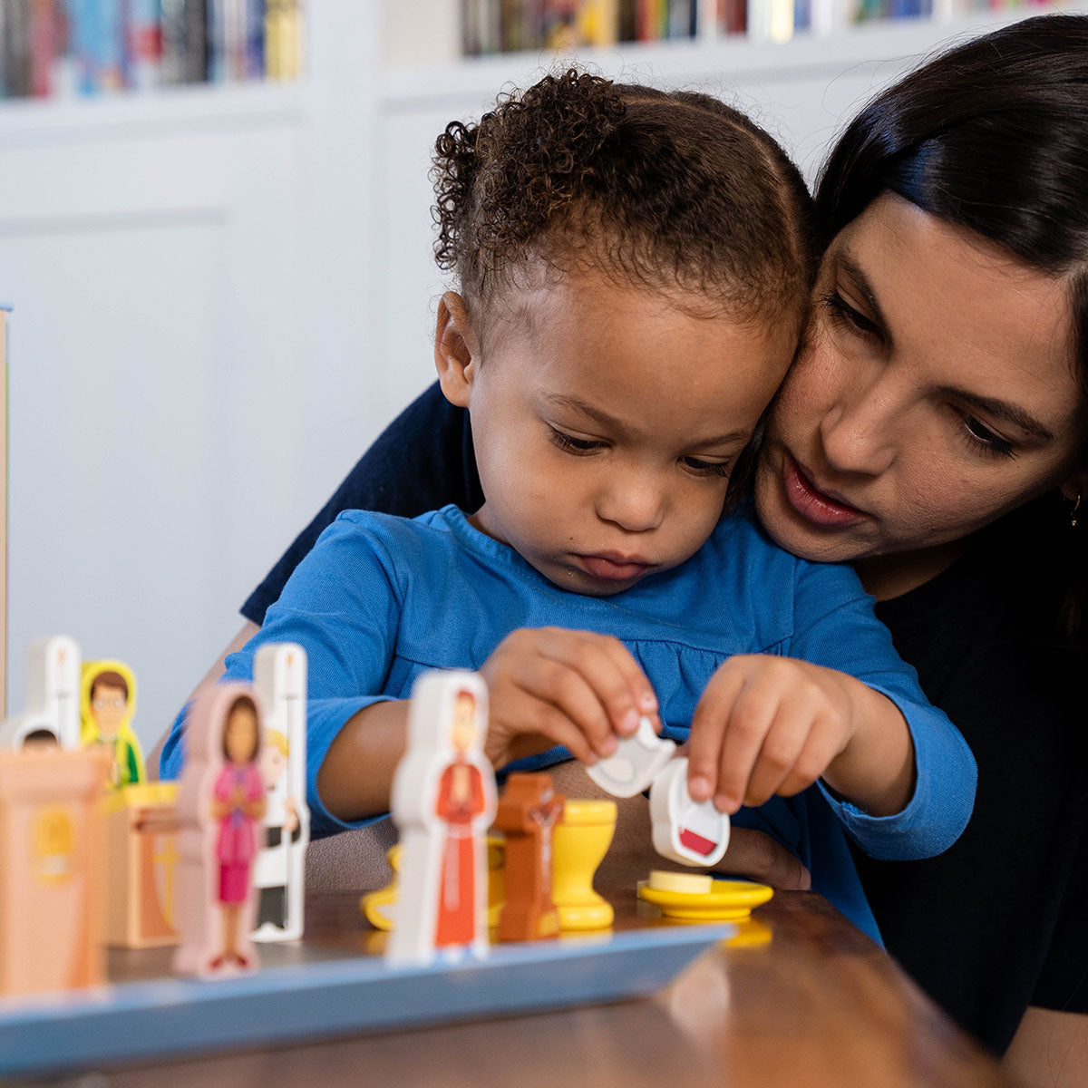 wooden church playset, mother and daughter playing