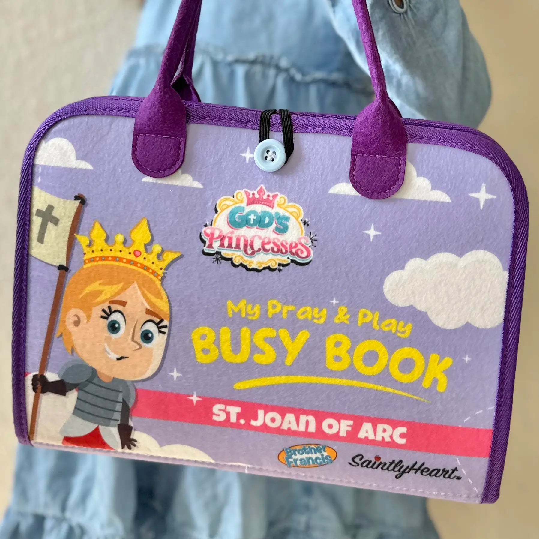 cover of purple felt busy book with saint joan of arc on cover